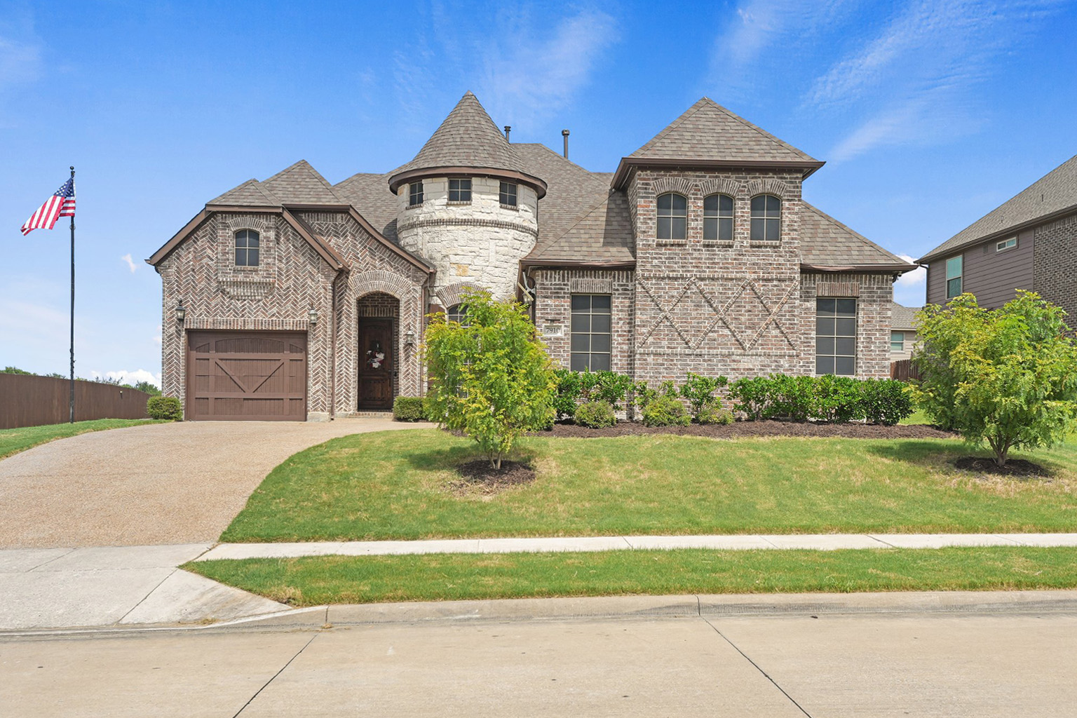 The same brick house photographed during daytime